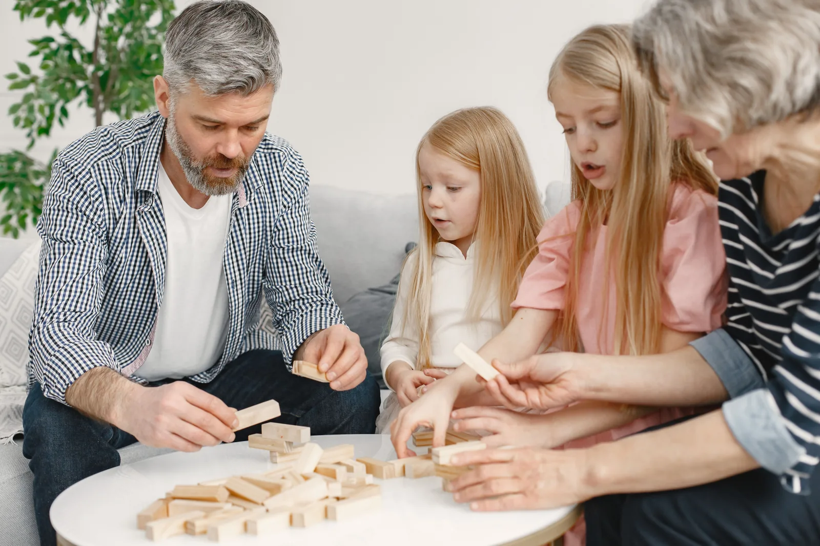 Multi-generational family playing together at home — Home, Business & Life Insurance in Los Angeles, CA | Blackstone Insurance Services
