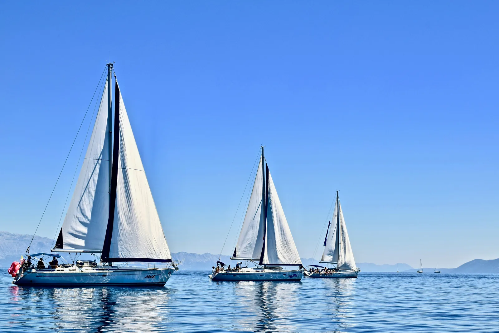 Sailboats on calm blue water — Home, Business & Life Insurance in Los Angeles, CA | Blackstone Insurance Services